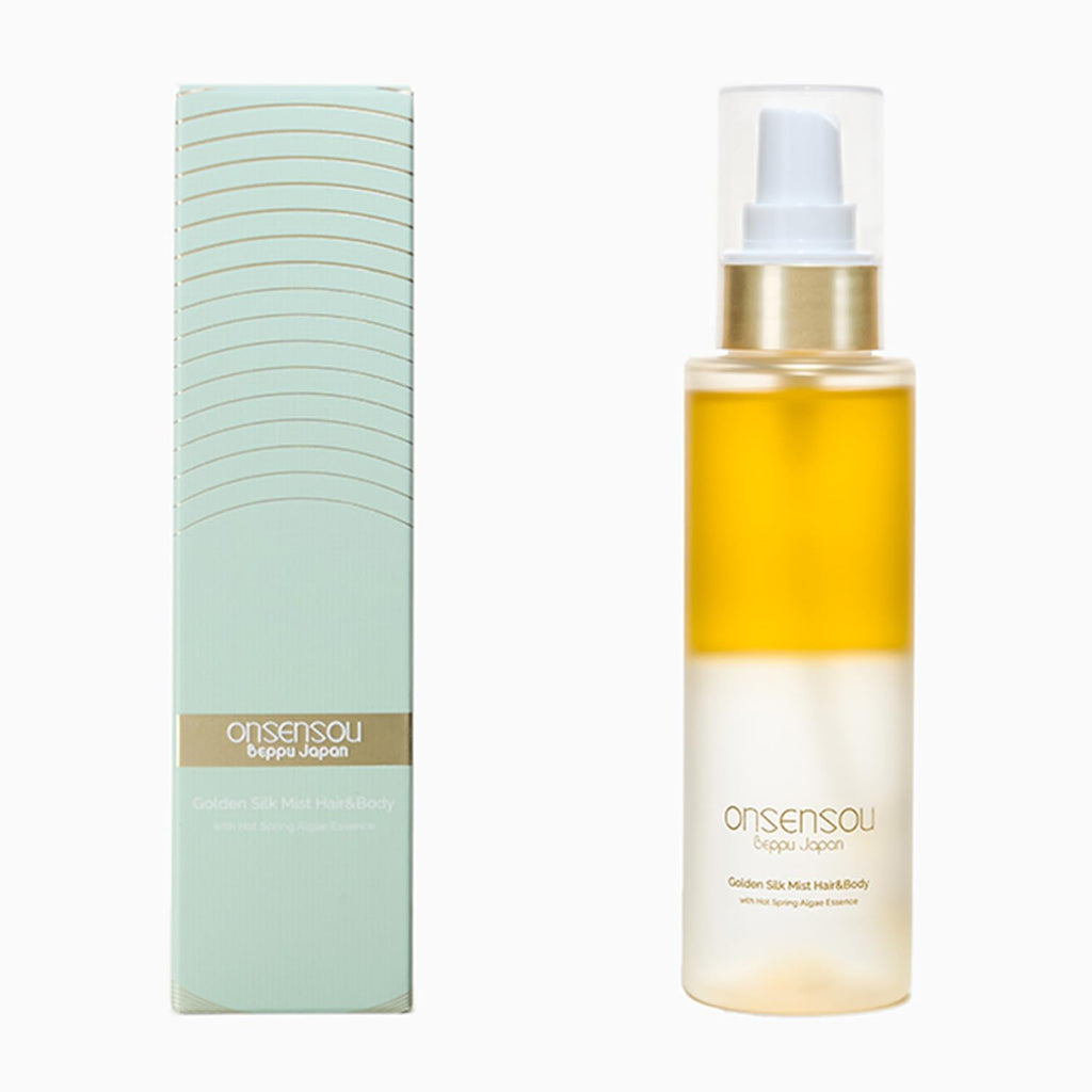 Onsensou Golden hair mist Cream on a white background, showing the clear bottle with golden-yellow cream and a metallic gold pump, next to its light green and gold packaging box.