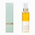 Onsensou Golden hair mist Cream on a white background, showing the clear bottle with golden-yellow cream and a metallic gold pump, next to its light green and gold packaging box.